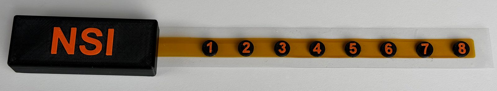 NSI sensing strip prototype with eight sensing locations along a flexible strip and electronics at one end
