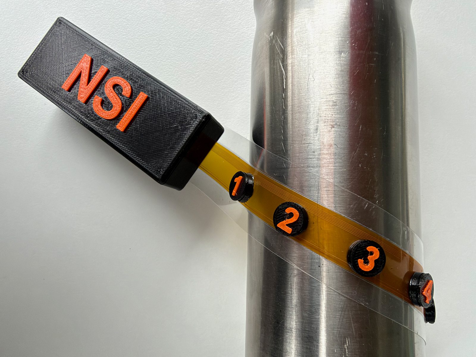 Kapton flex sensor strip wrapped around a pipe